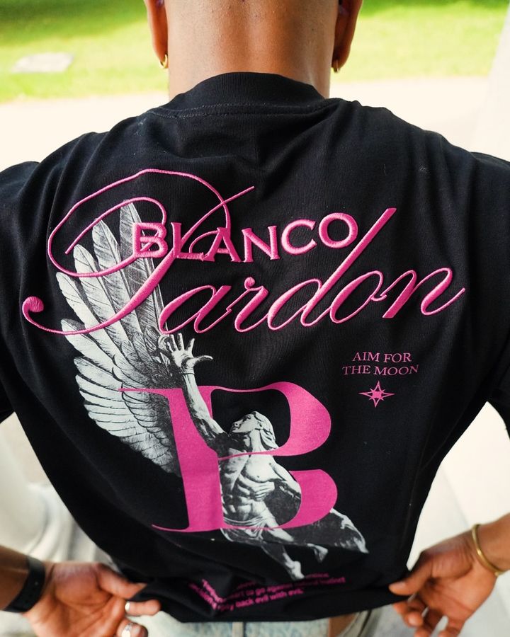 Pink Ikarus back print on a black BLANCO PARDON T-shirt